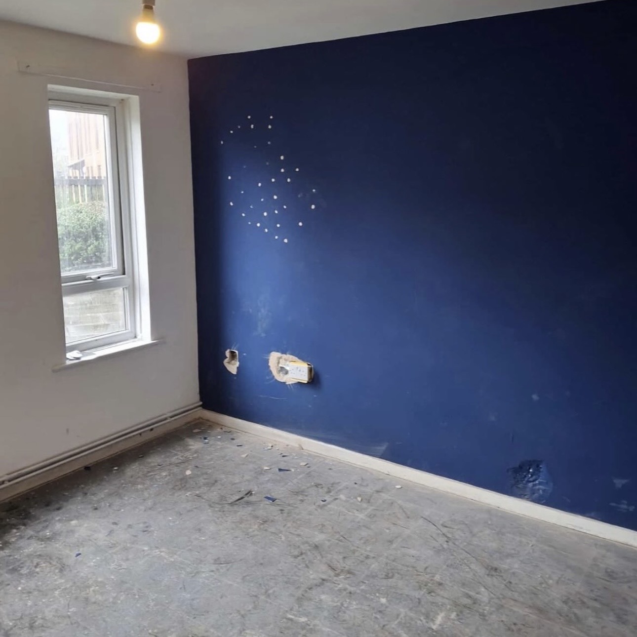Damaged wall before repair